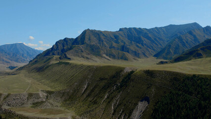 Green mountains of Altai under clear blue sky