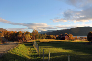 Panorama of the Norwegian countryside. Sunset of a field near the fjords and alps in northern Norway.
