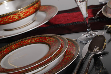 White premium porcelain tableware plates ready for dinner. Elegant table setting at home or restaurant with luxury dinnerware