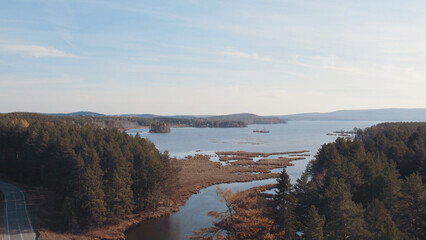 Closeup of lake and green forest in Ural