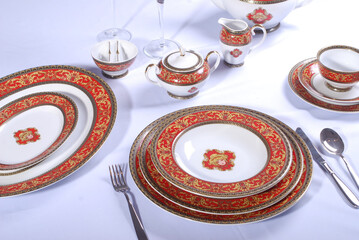 White porcelain tableware plates ready for dinner. Elegant table setting at home or restaurant with luxury dinnerware waiting for guests