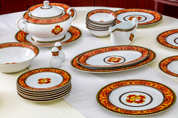 White porcelain tableware plates ready for dinner. Elegant table setting at home or restaurant with luxury dinnerware waiting for guests