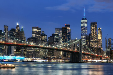 Manhattan skyline at night and Brooklyn bridge in New York City	