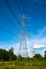 Standing street light post, electric pole and high voltage tower.High voltage transmission pole sunlight with blue sky background.