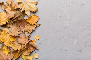 Autumn composition. Pattern made of dried leaves and other design accessories on table. Flat lay, top view