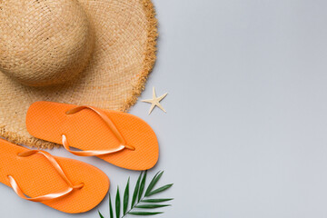 Summer vacation concept flat lay. straw hat beach accessories and towel top view. Space for text. travel concept