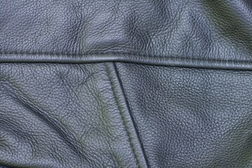 Fototapeta premium texture of fashionable leather black jacket with seams