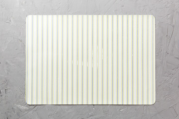 Top view of light tablecloth for food on cement background. Empty space for your design