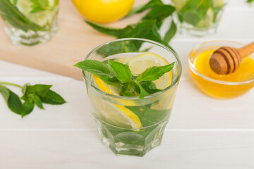 Mojito cocktail. Refreshing mojito cocktail with lime, lemon and mint in a tall glass with a stick