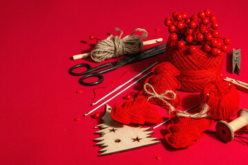 Festive handmade concept. Threads, crochet hooks, vintage scissors, New Year's or Christmas decor