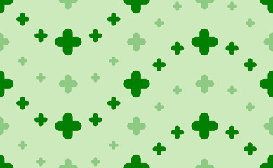 Seamless pattern of large and small green quatrefoil symbols. The elements are arranged in a wavy. Vector illustration on light green background