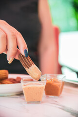 Churros with curry, olives and tomato paste on wooden table with Turkish tea