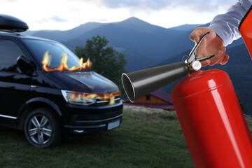 Man with fire extinguisher near car in flame outdoors, closeup