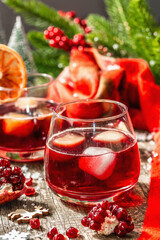 Non-alcoholic cocktail with fruits syrup and ice. Christmas traditional decor, New Year arrangement