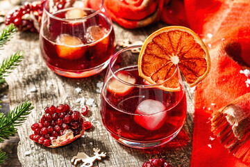 Non-alcoholic cocktail with fruits syrup and ice. Christmas traditional decor, New Year arrangement