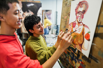 Multiracial students painting inside art room class - Focus on girl face