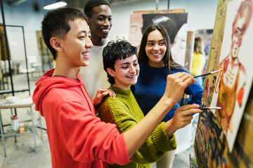 Multiracial students painting inside art room class at university - Focus on center girl face - Powered by Adobe