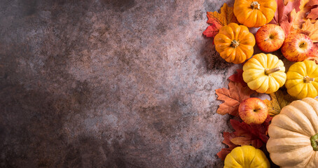 Autumn and thanksgiving decoration background concept with fall leaves, pumpkin and seasonal...