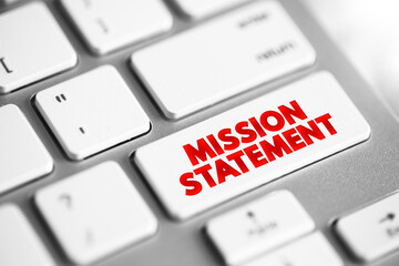 Mission Statement - concise explanation of the organization's reason for existence, text concept button on keyboard