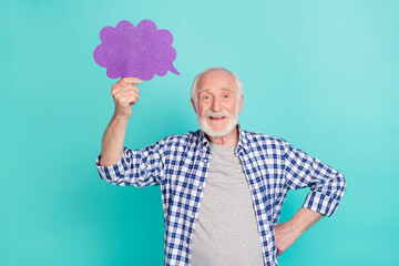 Photo of funny positive grandpa hold empty space cloud figure isolated on teal color background