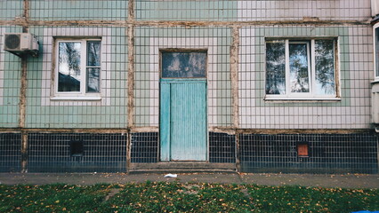 Old building in the city. Entrance of an apartment building.
