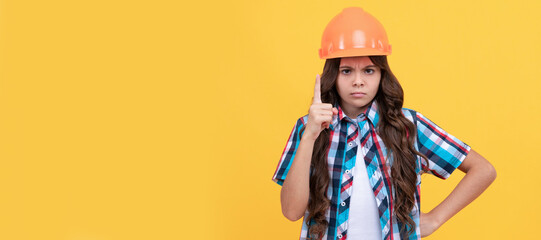 strict teen girl with curly hair in construction helmet, expert. Child builder in helmet horizontal poster design. Banner header, copy space.