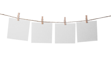 Clothespins with empty notepapers on string against white background. Space for text - obrazy, fototapety, plakaty