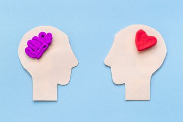 Brain and heart - logic and emotion. Communication between two paper human heads