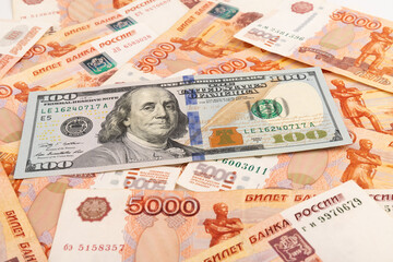US Dollar and Russian ruble. Money background. Currency exhange. Economic crisis. Rouble dollar cash. Hundred dollar bill and 5000 rubles. Business and finance. Russia and USA