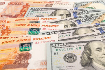 US Dollar and Russian ruble. Money background. Currency exhange. Economic crisis. Rouble dollar cash. Hundred dollar bill and 5000 rubles. Business and finance. Russia and USA