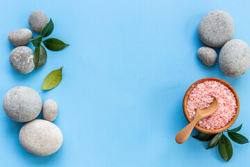 Spa stones for massage with roses and sea salt, top view