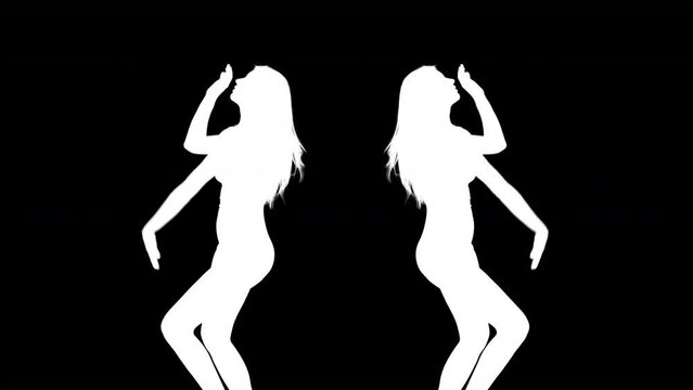 A female dancer moving in shadow