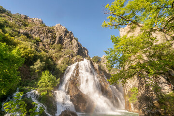 Fototapeta na wymiar Uçansu (cündüre)Waterfall, which is born in Gündoğmuş district at the summit of the Taurus Mountains and is approximately 50 m high, is known as the ‘hidden paradise in the forest.’