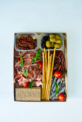 A set of meat and cheese snacks on a white background