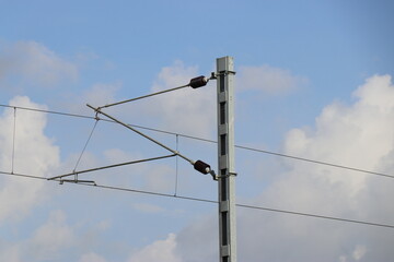 Electric wiring of trains with sky background in daylight