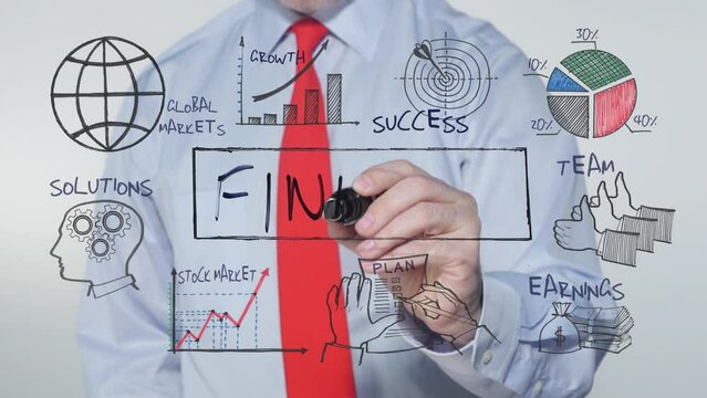 Businessman writing FINANCE 
