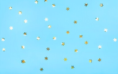 Golden snowflakes on a blue background. The perfect backdrop for your presentation. Christmas concept