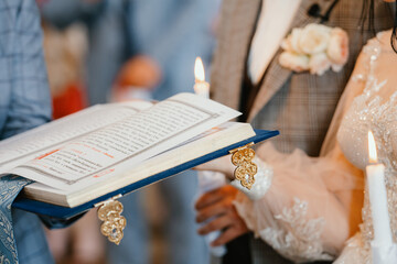 bride and groom holding hands in church