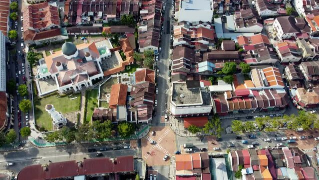 Aerial look down Georgetown Kapitan Keling Mosque and traffic in sunny day