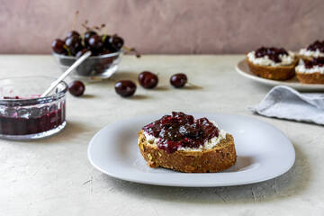 Wholewheat toasts with ricotta and homemade sweet cherry jam