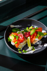 Sandwiches with salmon, lemon, beans, sesame seeds, tomatoes