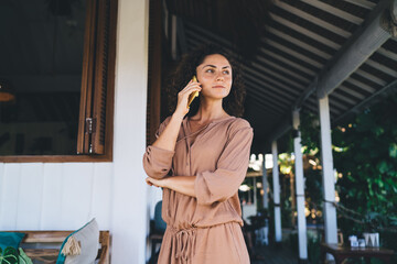 Caucasian woman in casual wear using roaming internet connection for making international conversation via mobile application, millennial female have consultancy communication via cellphone