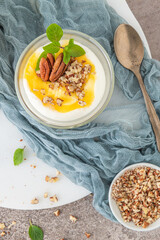 Natas do Ceu is a traditional Portuguese dessert made with cream, eggs and biscuits decorated with pecan nuts and mint leaves
