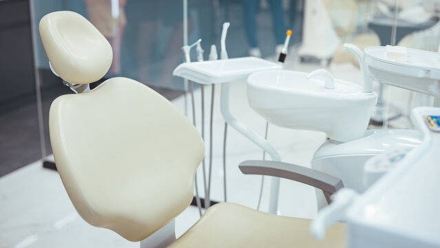 Modern dental practice. Dental chair and other accessories used by dentists. Dental chair and equipment. Patient reception room in a modern medical center.