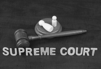 Supreme court decision about abortion concept. Words supreme court with gavel and people figures of...