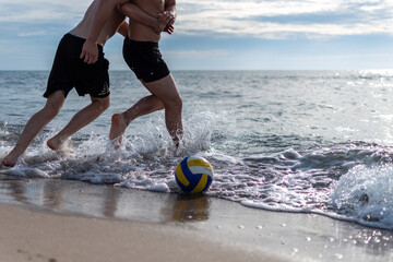 playing volleyball on the beach
