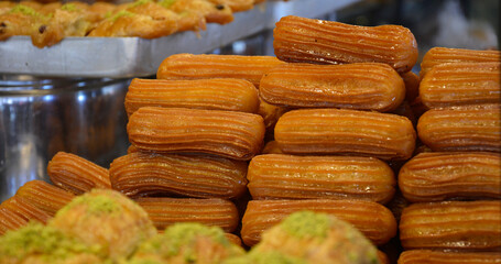 Traditional Turkish Delicious Tulumba Dessert in Adana. Desserts cooke in hot oil.