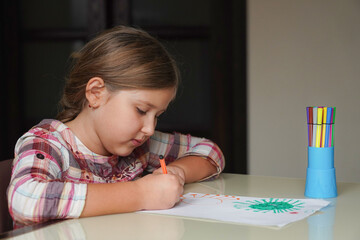  Cute little girl holds her drawing molecule Corona virus Omicron. World health coronavirus...