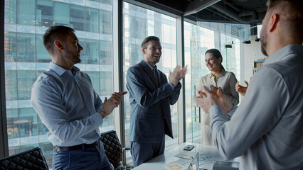 Successful business people applauding after closing a deal - 514205740