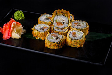 Warm rolls in batter with salmon, eel